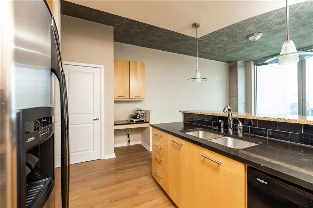 Functional kitchen open to the main living area and built in desk