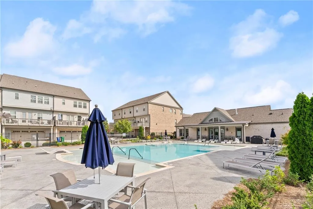 Community pool with a patio