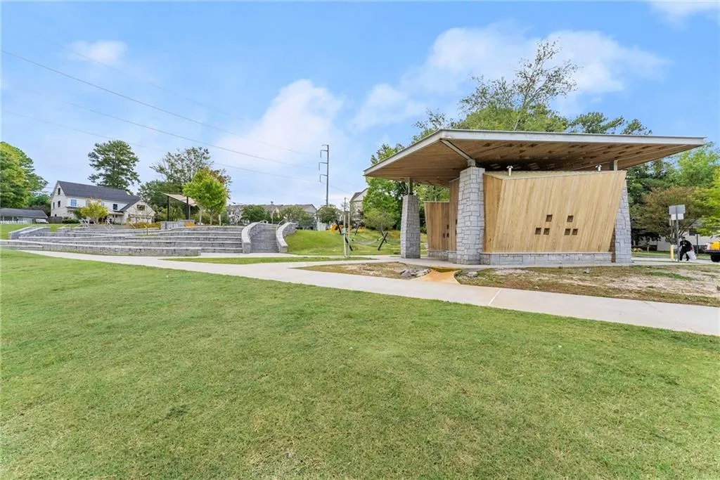 View of community featuring a lawn