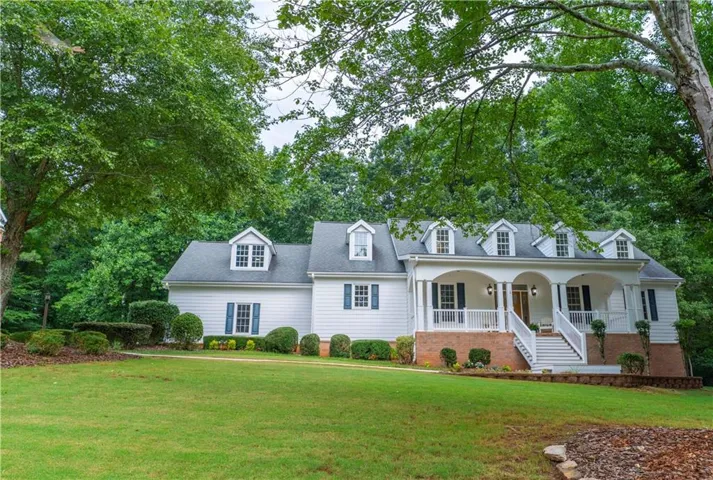 Classic Southern Colonial with a stately columned
rocking chair front porch, manicured landscaping,
and timeless curb appeal.