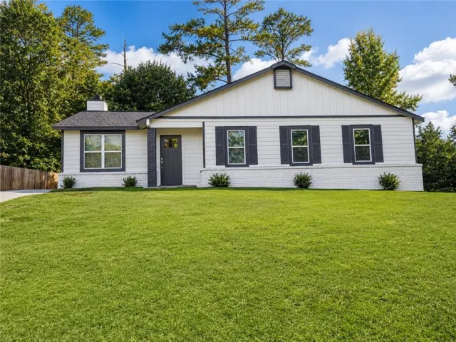 White exterior siding with dark trim accents