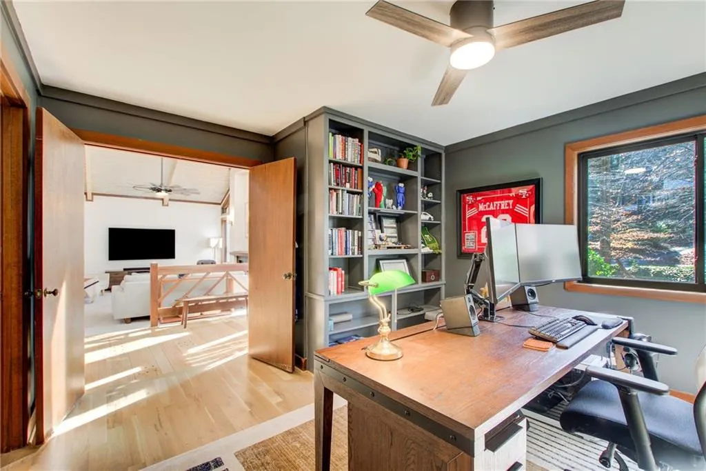 Home office featuring a ceiling fan and light wood finished floors