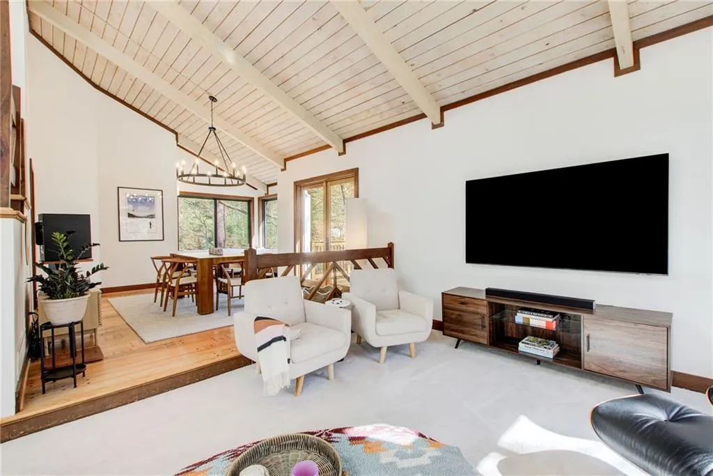 The fireside  family room connects to the banquet size dining room with it's own outdoor deck.