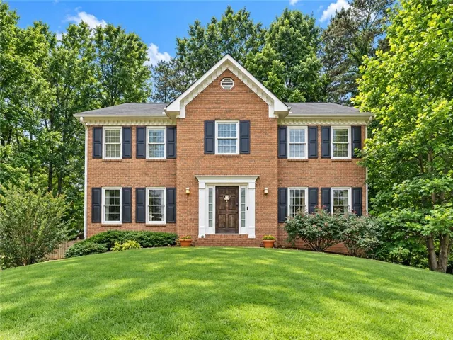 Set on a spacious corner lot, this stately brick home makes an unforgettable first impression with its timeless architecture, manicured lawn, mature trees, and warm, welcoming entrance. This is the kind of home buyers can picture themselves coming home to every day.