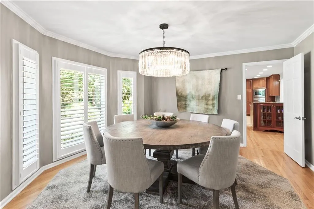 Floor to ceiling windows with plantation shutters add a great touch, kitchen adjoins for easy entertaining