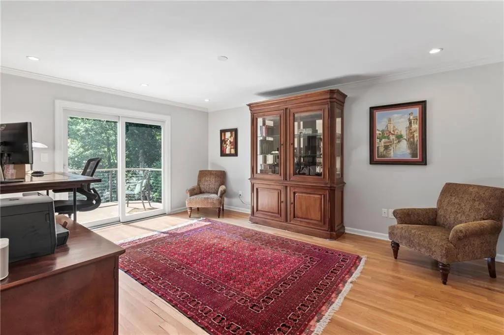 On the main floor, currently used as a home office/flex room with ensuite bath and steam shower