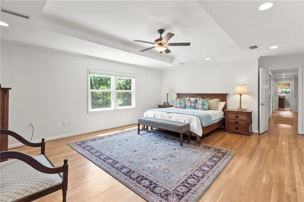 A truly oversized primary bedroom with plenty of room for a sitting area