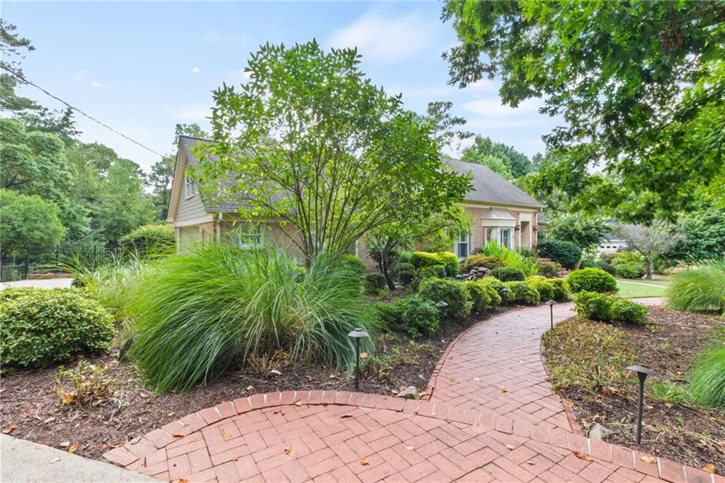 Custom and level brick walkway leading to the home makes a great first impression