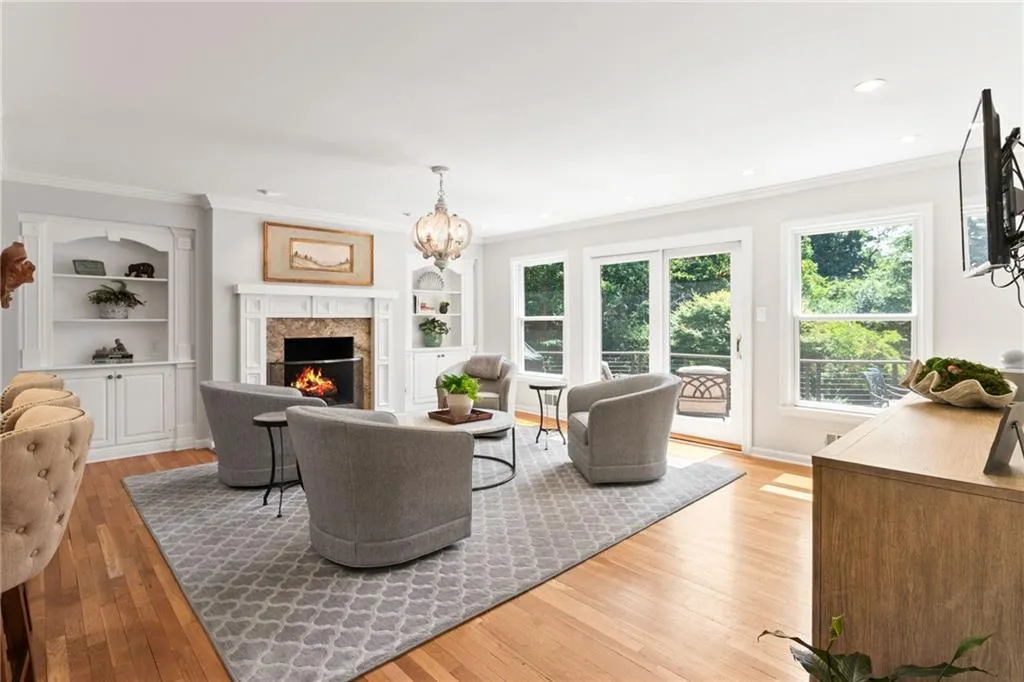 WOW! So much natural light and direct access to the large deck with pool and backyard views