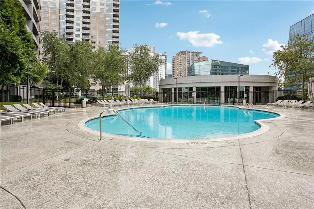 Community pool with a patio