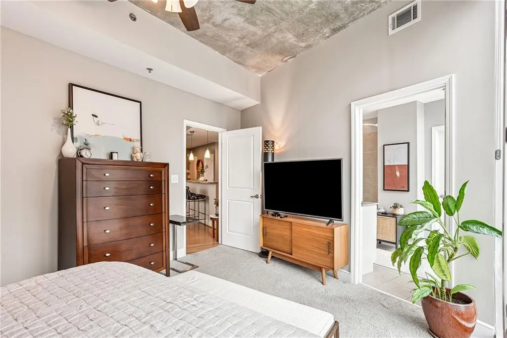 Bedroom featuring carpet flooring and ceiling fan