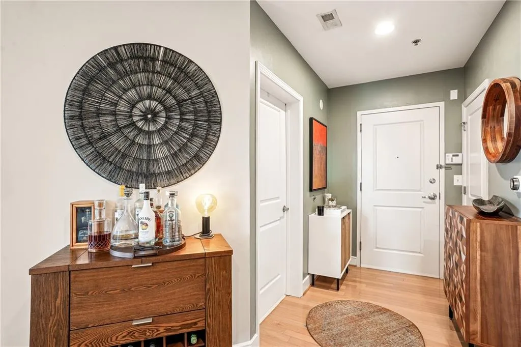 Foyer entrance with light wood-type flooring