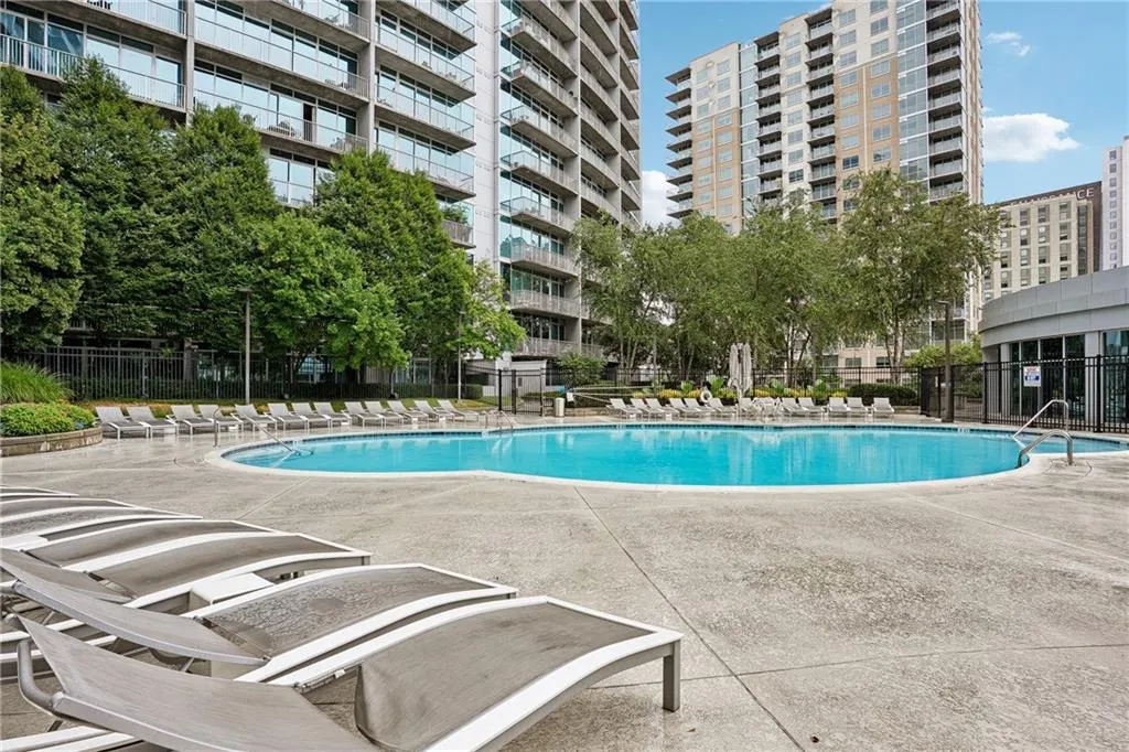 Community pool featuring a patio