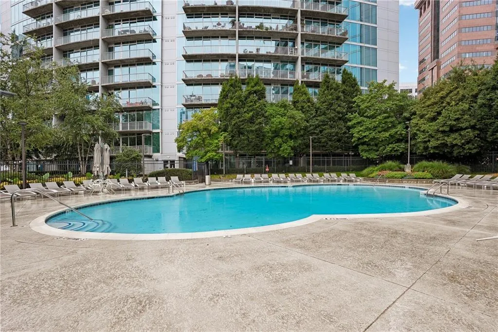 Community pool with a patio