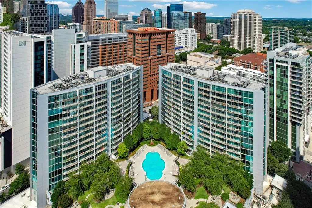 Bird's eye view of city skyline and a pool area