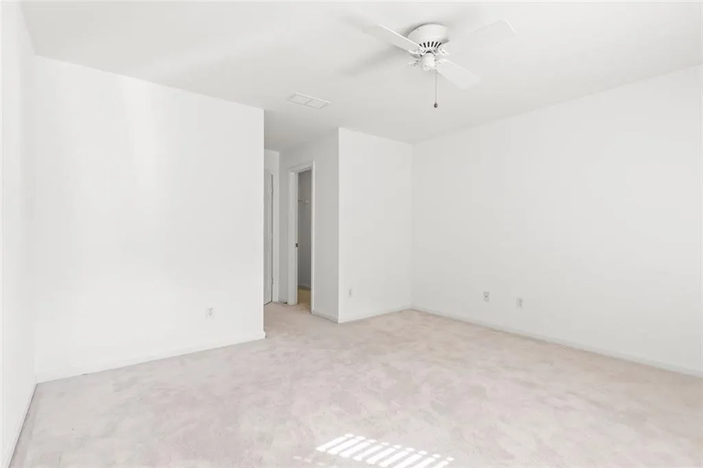 Another upstairs bedroom with walk-in closet and adjoining bath