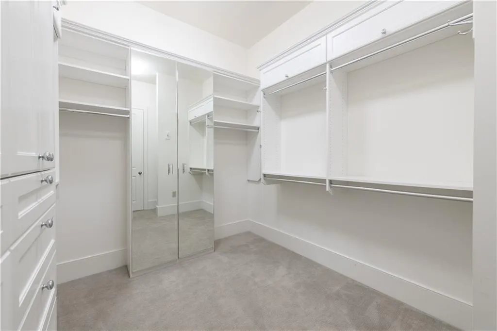 One of two spacious custom built closets in the primary suite