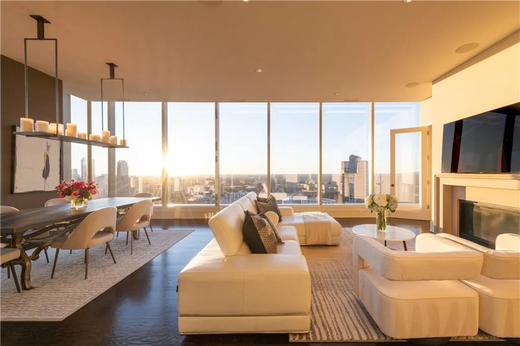 Living room and dining room with a sunset view