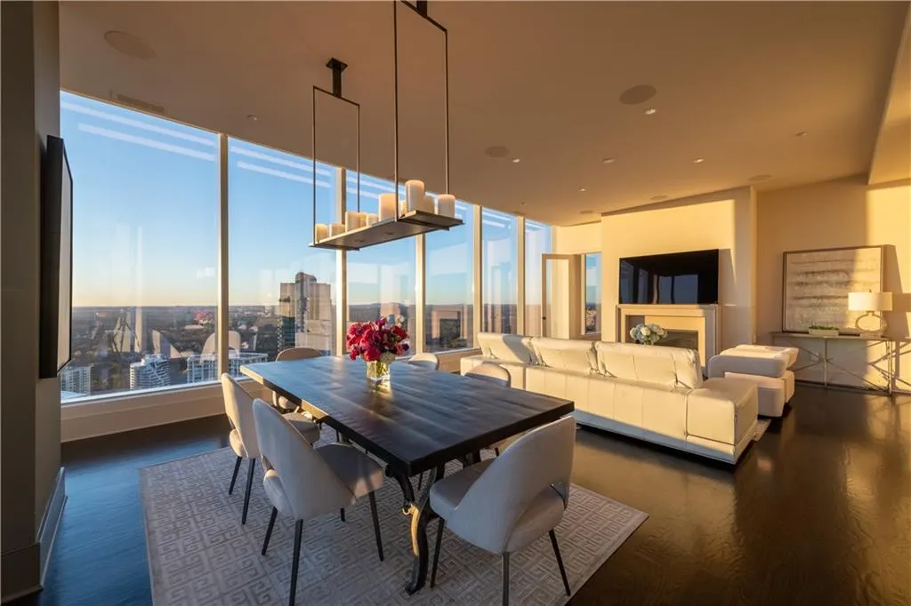 Dining and living room space with a fireplace