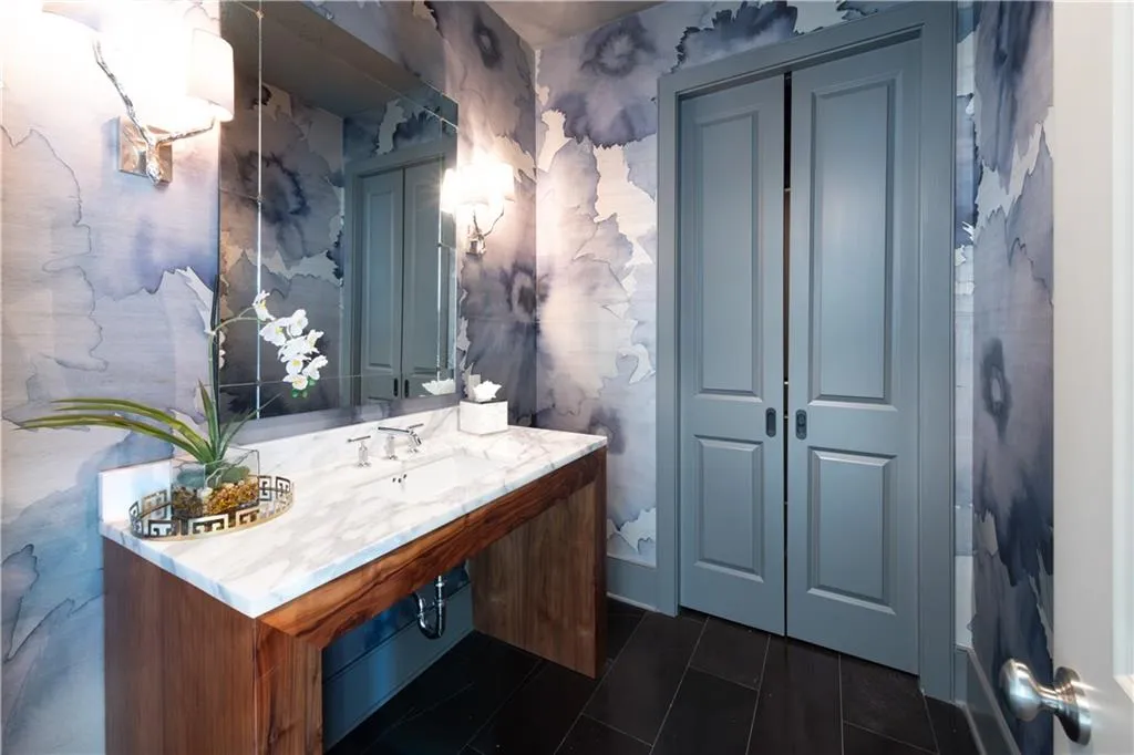 Powder room with tile patterned flooring and sink