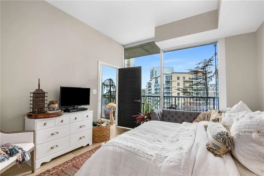 Bedroom with floor to ceiling windows