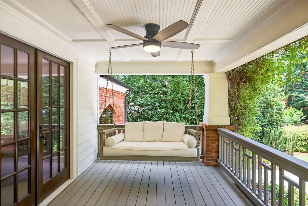 Covered porch featuring a beadboard ceiling, ceiling fan, and painted wood flooring
