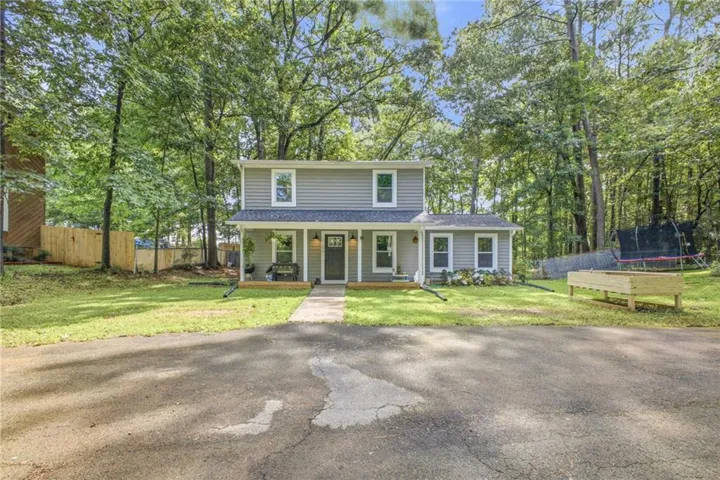 Two-story residence with gray siding and white trim