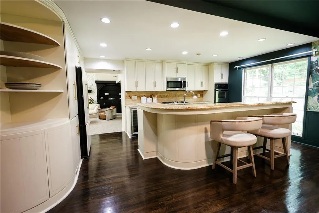 Open kitchen and breakfast room next to family room.