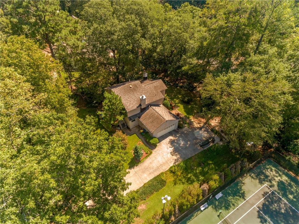 This lot has a beautiful tree canopy most of the year. The property is located next to the tennis court.
