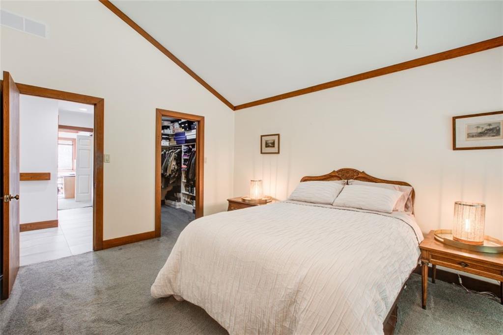 Guest bedroom with a spacious walk in closet.