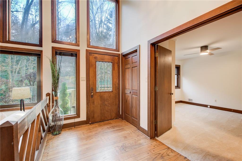 Foyer has beautiful hardwood flooring.