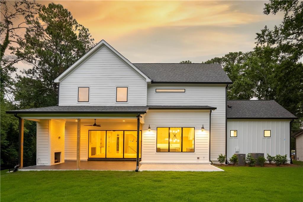 . Outside, the property offers a flat walk-out backyard, featuring a covered outdoor lounge with a fireplace and grilling patio—an ideal canvas for a future pool.