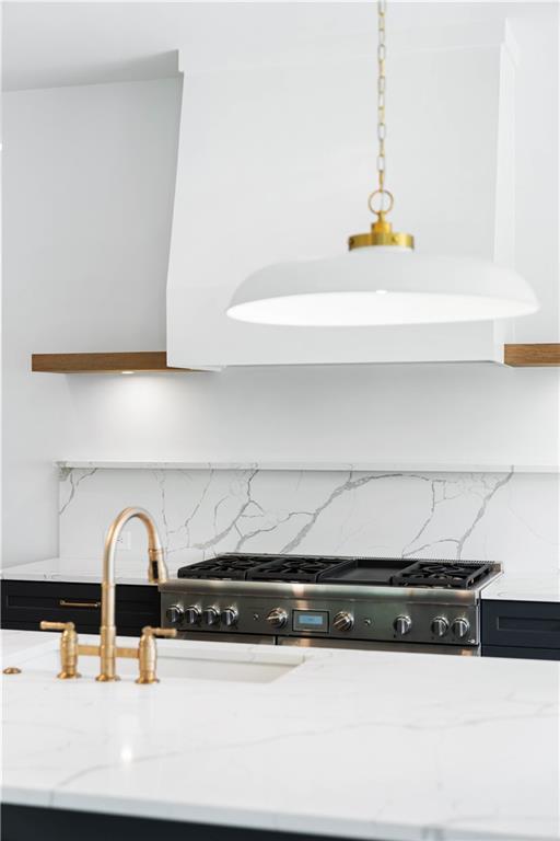 The chef's kitchen is a masterpiece, boasting custom shaker cabinetry with soft-close doors, a quartz backsplash, high-end stainless steel appliances, a custom range hood, and a breakfast area.