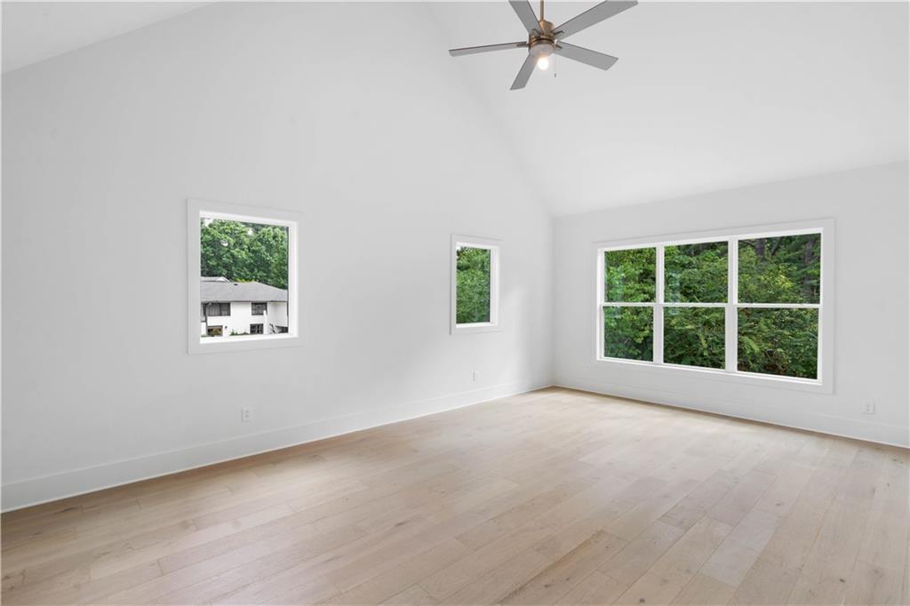 Ascend to the second level to discover the vaulted owners' suite, complete with a spa-like bathroom.