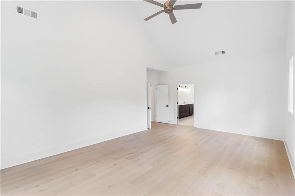 Ascend to the second level to discover the vaulted owners' suite, complete with a spa-like bathroom.