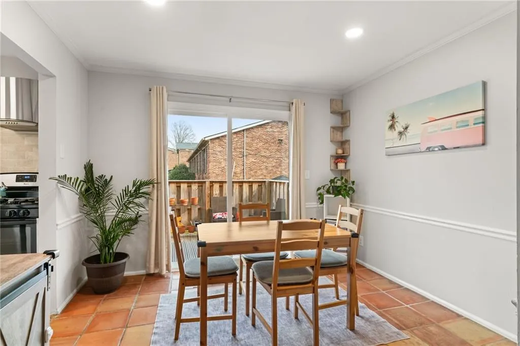 Dining space featuring light tile patterned floors, recessed lighting, baseboards, and ornamental molding