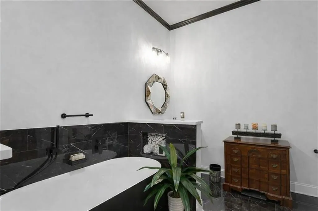 Full bathroom with vanity, a freestanding bath (virtually staged to remove excess)