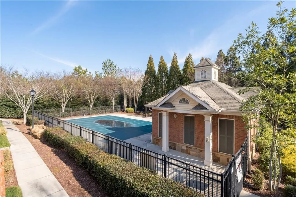 View of pool featuring covered porch
