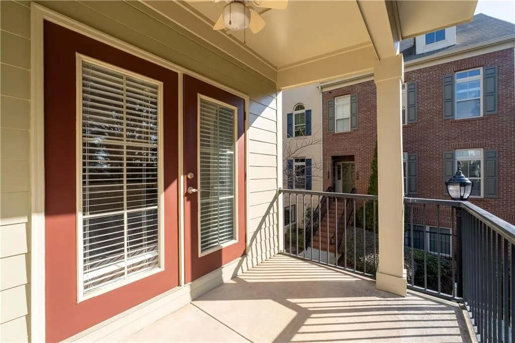 Balcony featuring a ceiling fan