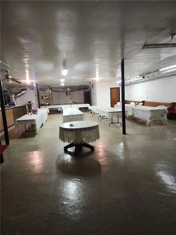 Basement featuring ceiling fan