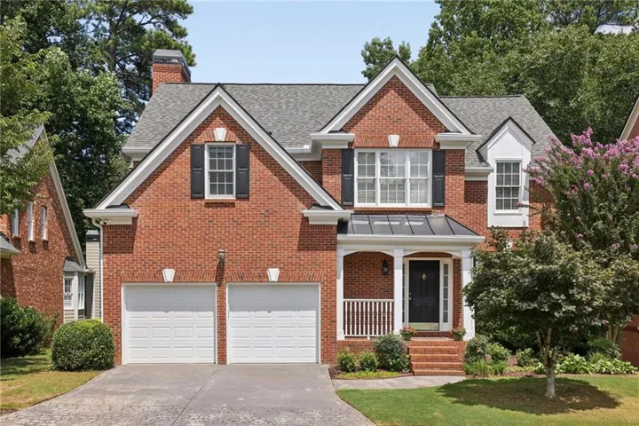 Wonderful curb appeal on this brick traditional home