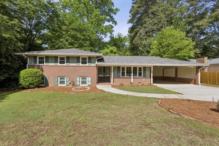 Classic Brick Split Level With Covered Porch And Elevated Curb Appeal