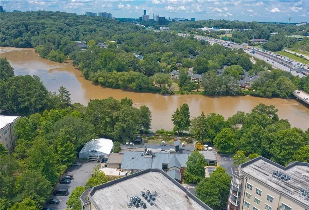 Aerial view of a large body of water and a tree filled landscape