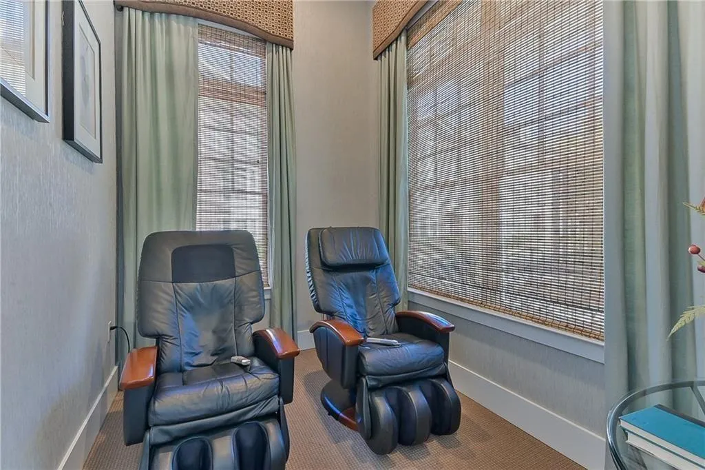 Living area with carpet floors and baseboards