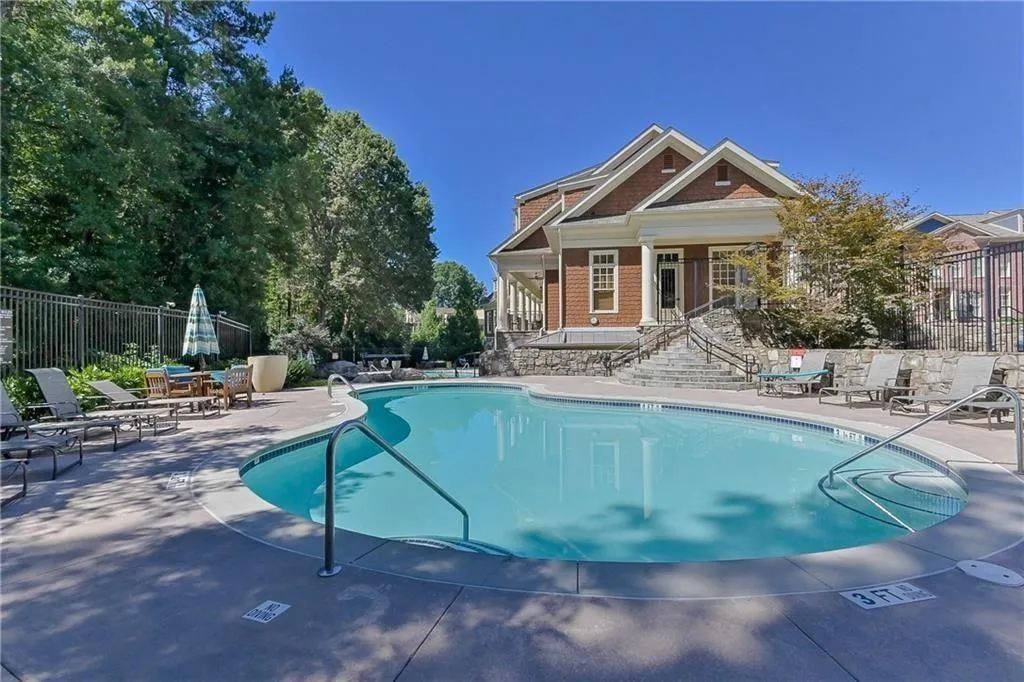 Community pool featuring a patio area