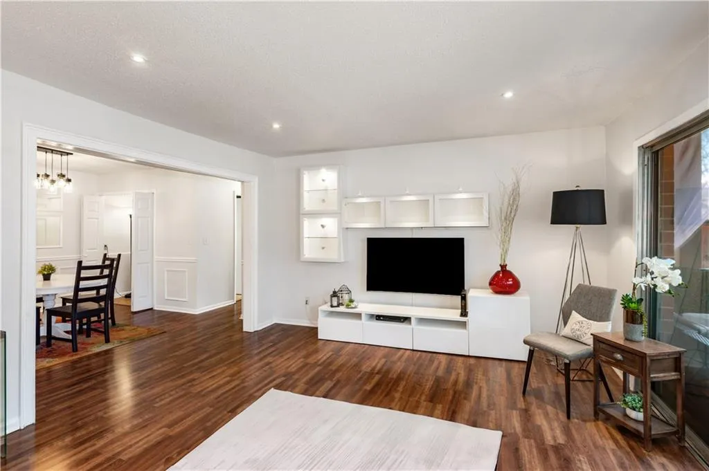 Living room featuring a chandelier and dark hardwood / wood-style floors