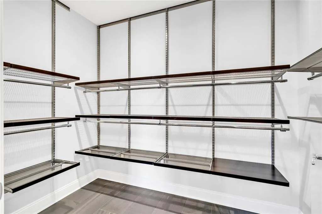 Spacious Primary Closet with Elfa adjustable shelving