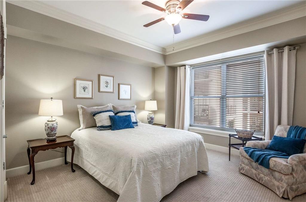 This unit has a split bedroom plan offering your guests total privacy!  This bed is a queen and still lots of space for other pieces of furniture!  Huge walk in closet with a custom Elfa system!  Notice the rich crown moldings even in the secondary bedrooms.