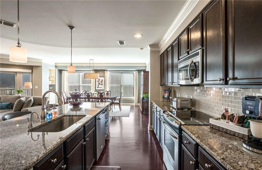 Ample amount of counter space will hold all your kitchen needs...coffee station, juice makers or toasters all have a home without feeling too crowded.  Plus, sink was replaced with large single vessel sink to make washing up your platters a cinch!
