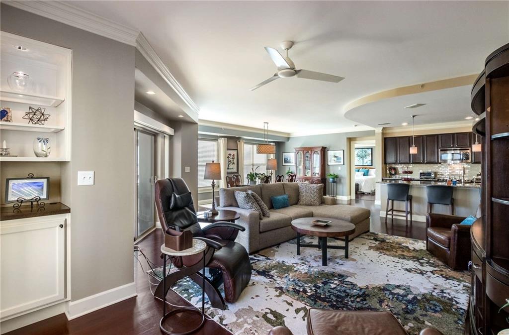 The other built in nook with glass shelving and lighting is a show stopper.  Newer lightning with dimmers has also been added above windows and doors for such a warm and inviting environment once the sun goes down.